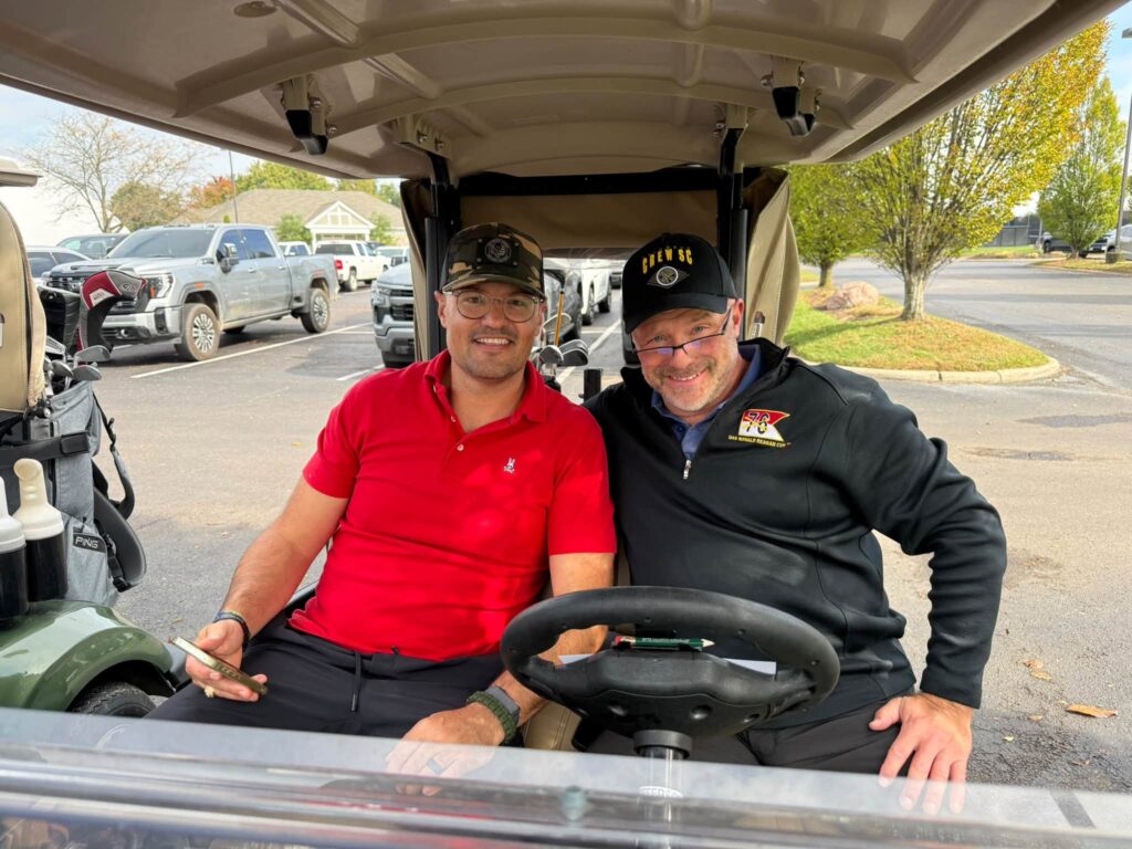 Two golfers in their cart before the shotgun start